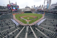 Baseball fans watch the opening ceremony of the Detroit Tigers and Cleveland Indians baseball game at Comerica Park, Thursday, April 1, 2021, in Detroit. (AP Photo/Carlos Osorio)