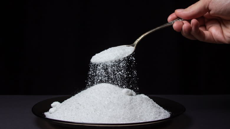 salt being poured from spoon