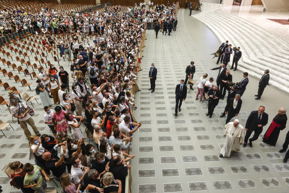 Pope Francis greets the faithful at the end of his weekly general audience in the Paul VI hall at the Vatican, Wednesday, Aug. 11, 2021. (AP Photo/Riccardo De Luca)