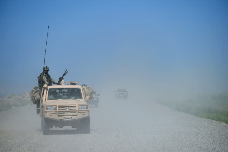 Afghan security forces patrol in Kunduz, the site of continued conflict with the Taliban, on April 30, 2015