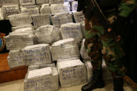 Peruvian police show to the press more than two tonnes of cocaine hidden in packages of asparagus destined for Amsterdam, and arrested a Serbian man and four Peruvians suspected of running a smuggling operation from a gourmet food business, authorities said, at police headquarters in Lima, Peru, January 12, 2017. REUTERS/Mariana Bazo