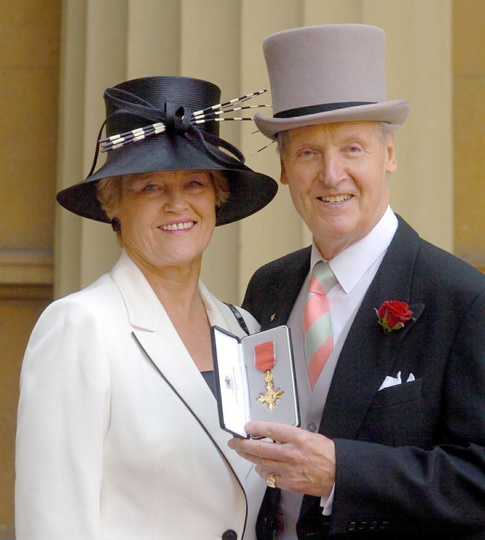 Nicholas Parons with his wife Annie after receiving an OBE (PA )