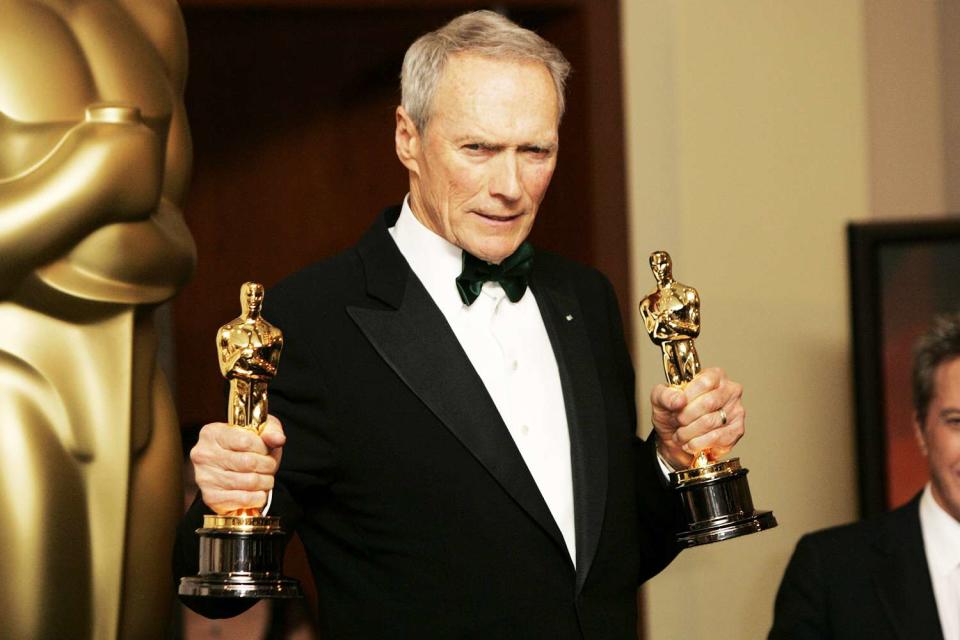 <p>Chris Polk/FilmMagic</p> Clint Eastwood holds the Oscars he earned for Best Picture and Best Director in 2005