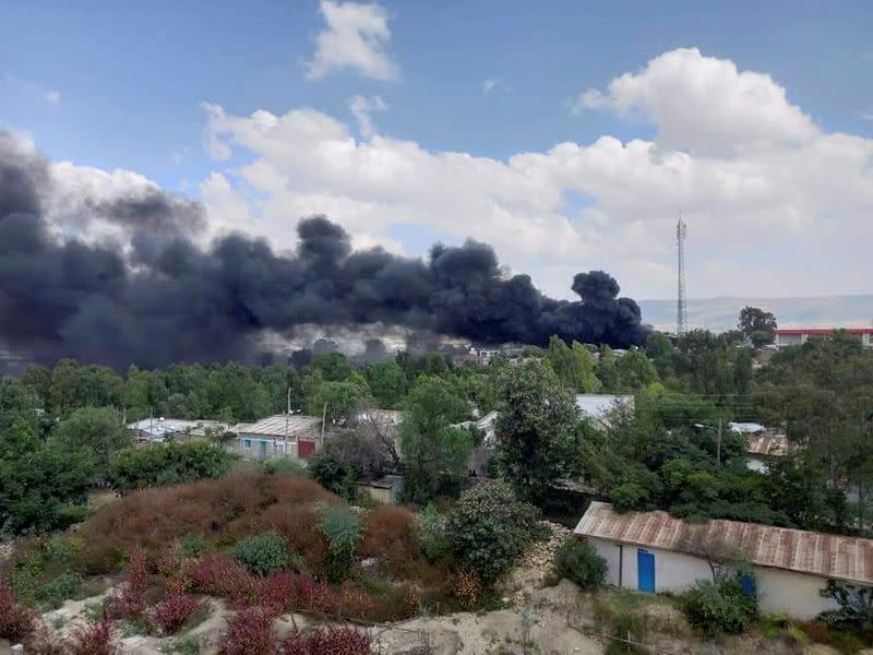 FILE PHOTO: Smoke billows from the scene of an air strike, in Mekelle