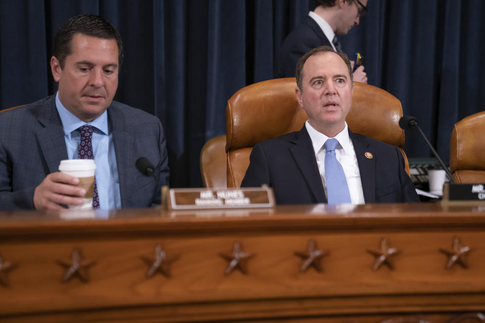 House Intelligence Committee Chairman Adam Schiff, D-Calif., right, joined by Rep. Devin Nunes, R-Calif, left, the ranking member, opens a hearing on politically motivated fake videos and manipulated media, on Capitol Hill in Washington, Thursday, June 13, 2019. (AP Photo/J. Scott Applewhite)