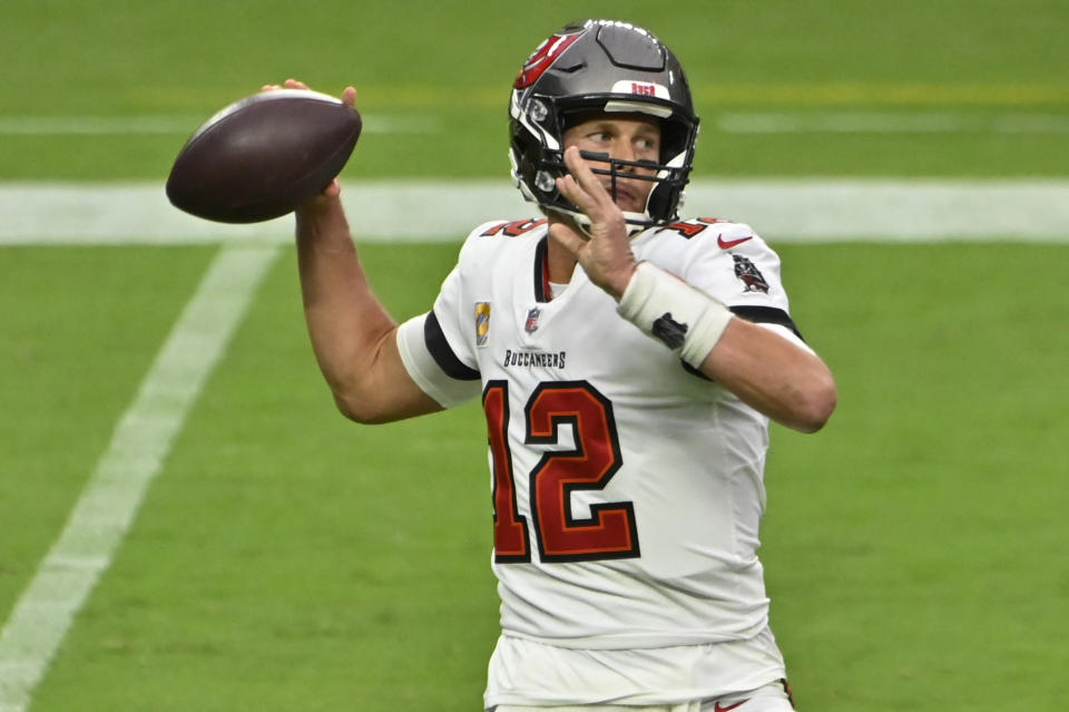 Tampa Bay Buccaneers quarterback Tom Brady (12) throws against the Las Vegas Raiders during the first half of an NFL football game, Sunday, Oct. 25, 2020, in Las Vegas. (AP Photo/David Becker)