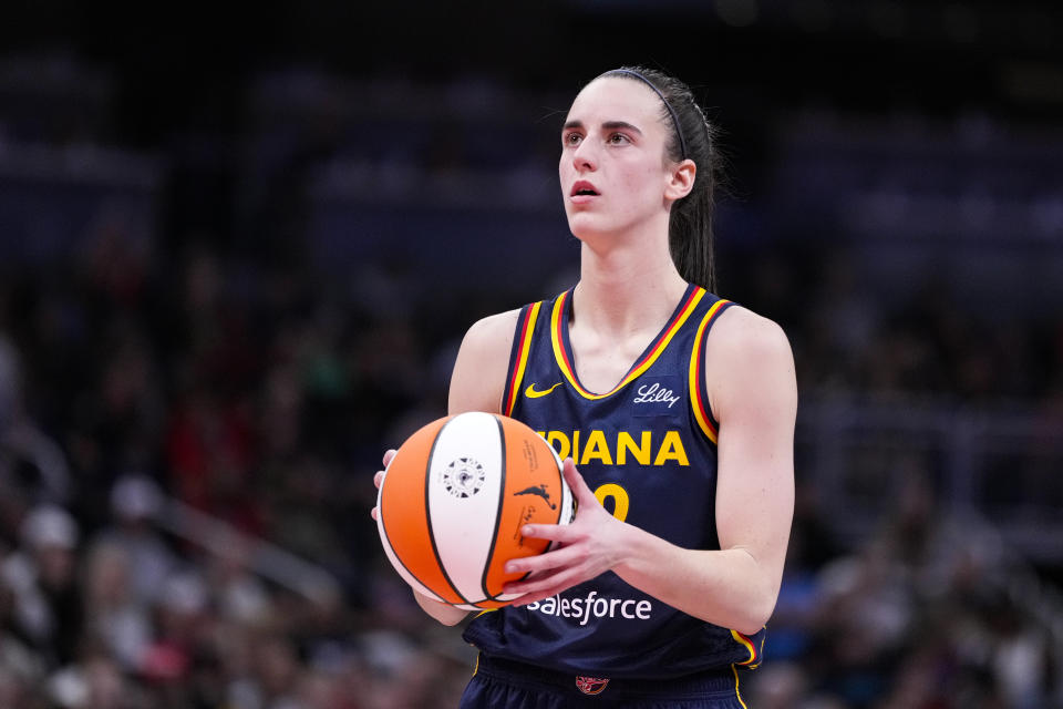 Indiana Fever point guard Caitlin Clark (22) plays against the Los Angeles Sparks in the first half of a WNBA basketball game in Indianapolis, Tuesday, May 28, 2024. (AP Photo/Michael Conroy)