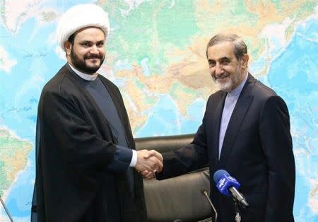 Akram Kaabi, the leader of Nujaba, (L) meets with Ali Akbar Velayati, senior advisor to Supreme Leader Ayatollah Ali Khamenei, in Tehran, Iran, in this handout photo released by Tasnim News Agency on September 1, 2016. Tasnim News Agency/Handout via REUTERS