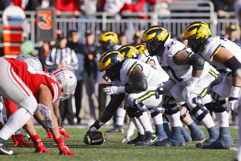 COLUMBUS, OH - NOVEMBER 26: Michigan Wolverines and Ohio State Buckeyes players line up at the line of scrimmage before the snap during a college football game on November 26, 2022 at Ohio Stadium in Columbus, Ohio. (Photo by Joe Robbins/Icon Sportswire via Getty Images)