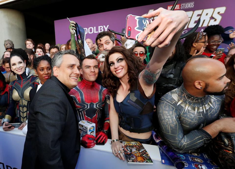 Joe Russo poses with fans on the red carpet at the world premiere of the film "The Avengers: Endgame" in Los Angeles, California, April 22, 2019.