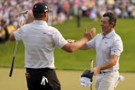 Rory McIlroy, of Northern Ireland, greets Michael Block after their final round of the PGA Championship golf tournament at Oak Hill Country Club on Sunday, May 21, 2023, in Pittsford, N.Y. (AP Photo/Seth Wenig)