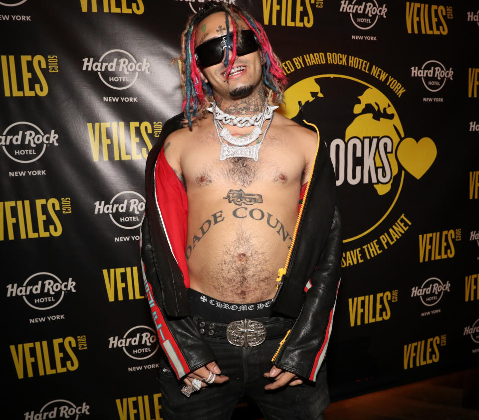 Lil Pump posed shirtless in an unzipped jacket, sunglasses and multiple chains at the VFILES event in collaboration with New York's Hard Rock Hotel.