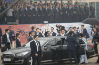 South Korean President Moon Jae-in, center, waves as he leaves after attending a ceremony for the 71st anniversary of Armed Forces Day at the Air Force Base in Daegu, South Korea Tuesday, Oct. 1, 2019. (Jeon Heon-kyun/Pool Photo via AP)