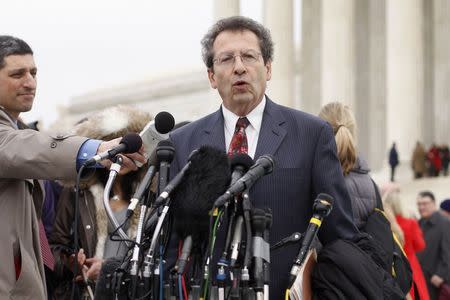 Sam Kazman, one of the attorneys against the U.S. government in the King v. Burwell case, speaks to reporters after arguments at the Supreme Court building in Washington, March 4, 2015. REUTERS/Jonathan Ernst