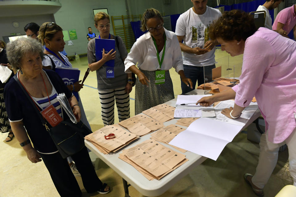 Election officials count ballots at a polling station in Pamplona, northern Spain, Sunday July 23, 2023. Voters in Spain went to the polls Sunday in an election that could make the country the latest European Union member to swing to the populist right, a shift that would represent a major upheaval after five years under a left-wing government.(AP Photo/Alvaro Barrientos)