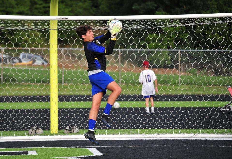 Ontario's Dante McGinty makes an athletic save during the Warriors' draw with Clear Fork on Wednesday night at Clear Fork High School.