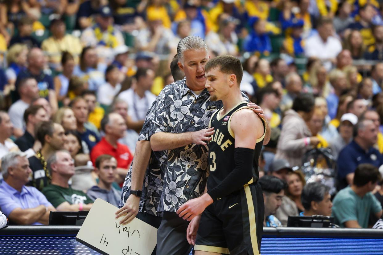 HONOLULU, HAWAII - NOVEMBER 22: Head coach Matt Painter of the Purdue Boilermakers speaks to Braden Smith #3 during the first half of their game in the Allstate Maui Invitational at SimpliFi Arena on November 22, 2023 in Honolulu, Hawaii. (Photo by Darryl Oumi/Getty Images)