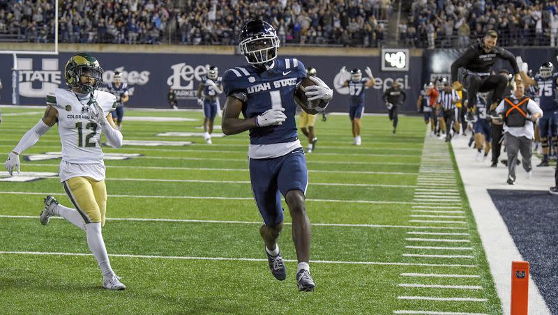 Utah State receiver Jalen Royals runs into the end zone for a touchdown against Colorado State Saturday, Oct. 7, 2023, in Logan, Utah.