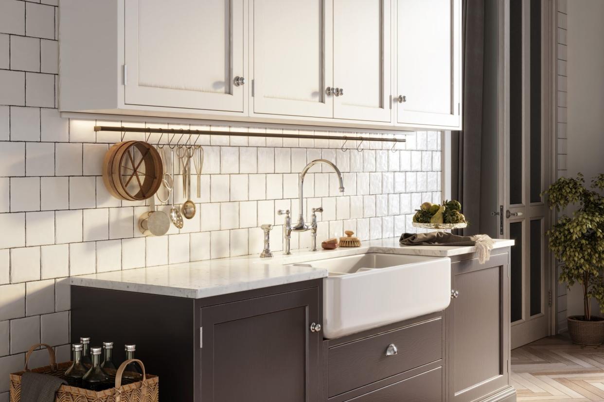 modern kitchen with gold finishes and farmhouse sink