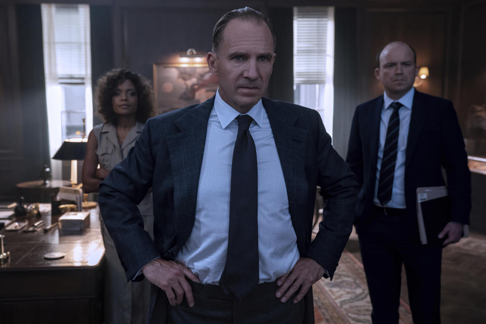 This image released by Metro Goldwyn Mayer Pictures shows, from left, Naomie Harris, Ralph Fiennes and Rory Kinnear in a scene from "No Time To Die." (Nicola Dove/Metro Goldwyn Mayer Pictures via AP)