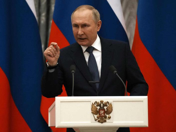 Russian President Vladimir Putin gestures during a joint press conference with French President after their meeting in Moscow, on February 7, 2022. - International efforts to defuse the standoff over Ukraine intensified with French President holding talks in Moscow and German Chancellor in Washington to coordinate policies as fears of a Russian invasion mount. (Photo by Thibault Camus / POOL / AFP) (Photo by THIBAULT CAMUS/POOL/AFP via Getty Images)