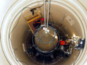 FILE PHOTO: A U.S. Air Force missile maintenance team removes the upper section of an intercontinental ballistic missile with a nuclear warhead in an undated USAF photo at Malmstrom Air Force Base, Montana, U.S. U.S. Air Force/Airman John Parie/Handout via REUTERS