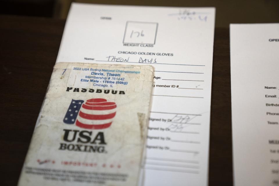 Theon Davis' USA Boxing passbook awaits his arrival on a night of quarter-final boxing matches at the Chicago Golden Gloves tournament Thursday, March 16, 2023, at Cicero Stadium in Cicero, Ill. Davis is a 21-year-old boxer from Chicago who fights at the 176-pound weight class. All contenders for the Chicago Golden Gloves are required to register with the USA Boxing-sanctioned event that turns 100 years old this year. (AP Photo/Erin Hooley)