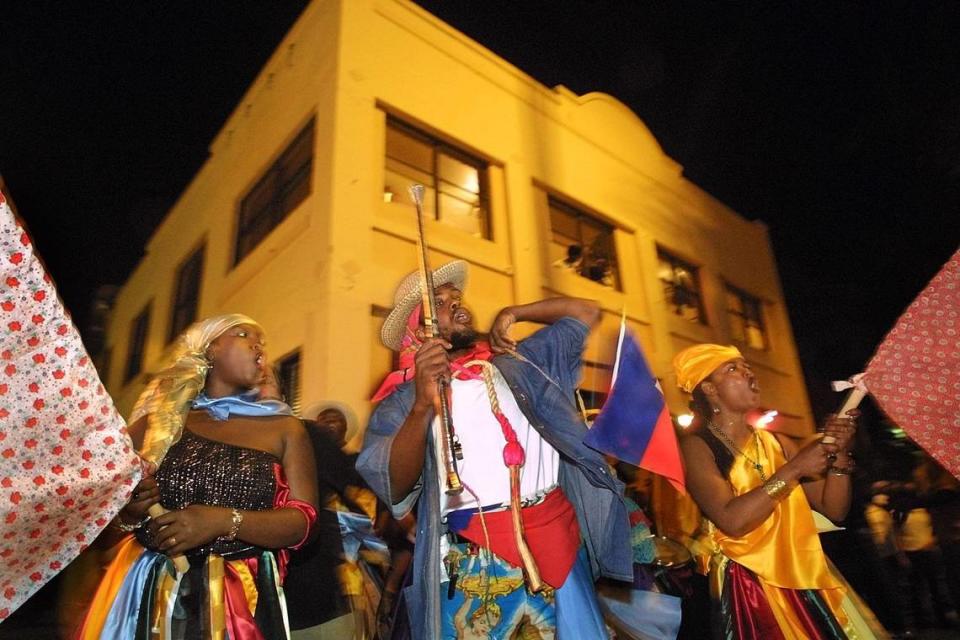 Revelry in the street outside Tap Tap restaurant for the Fet Ra Ra parade in Miami Beach in 2002.