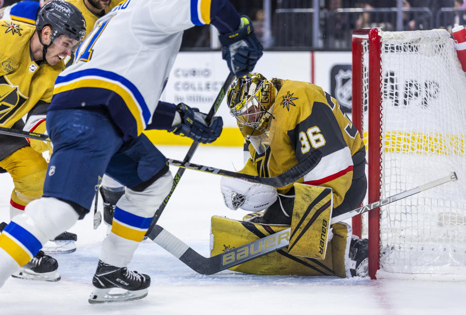 Vegas Golden Knights goaltender Logan Thompson (36) stops a shot by St. Louis Blues right wing Vladimir Tarasenko (91)) during the first period of an NHL hockey game Friday, Dec. 23, 2022, in Las Vegas. (AP Photo/L.E. Baskow)