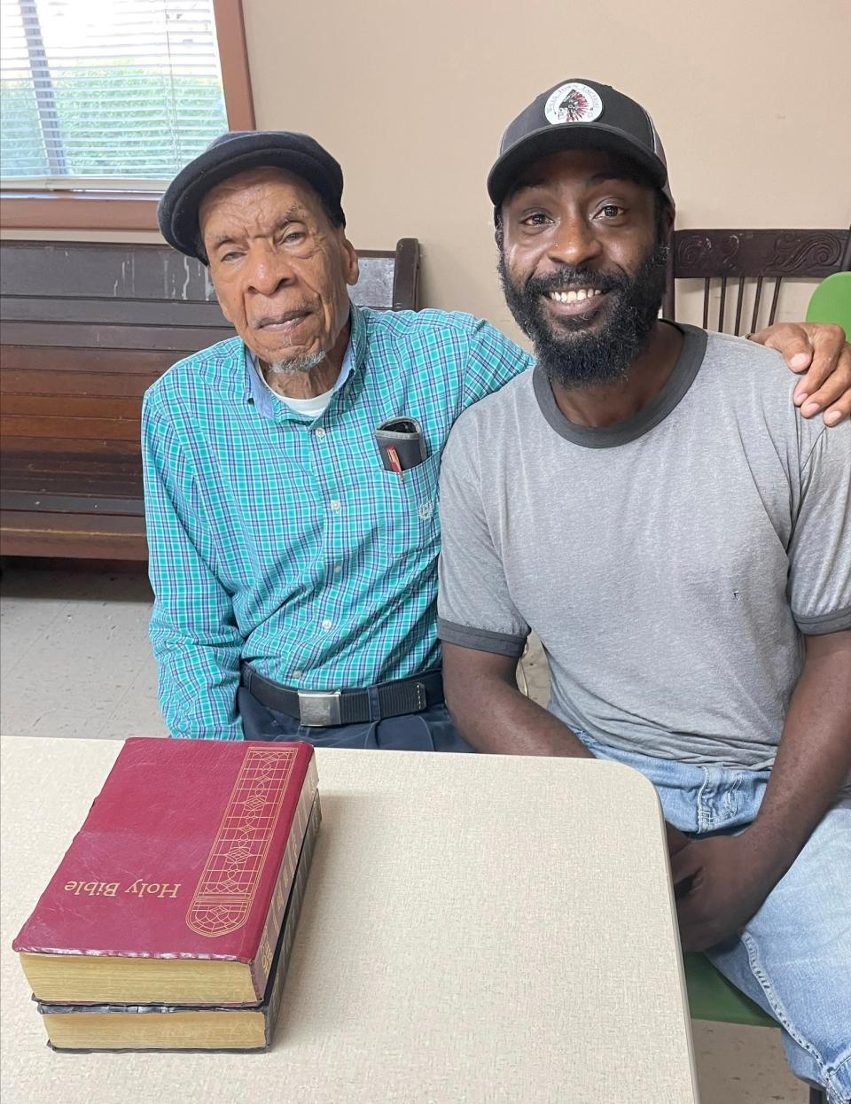 Former Gregory High School educator and current pastor, Owen “O.J.” Ford, left, and Timothy "Cas" Smith discuss the history of the school at Collins United Methodist Church in Collinsville, Alabama, on June 28, 2023.