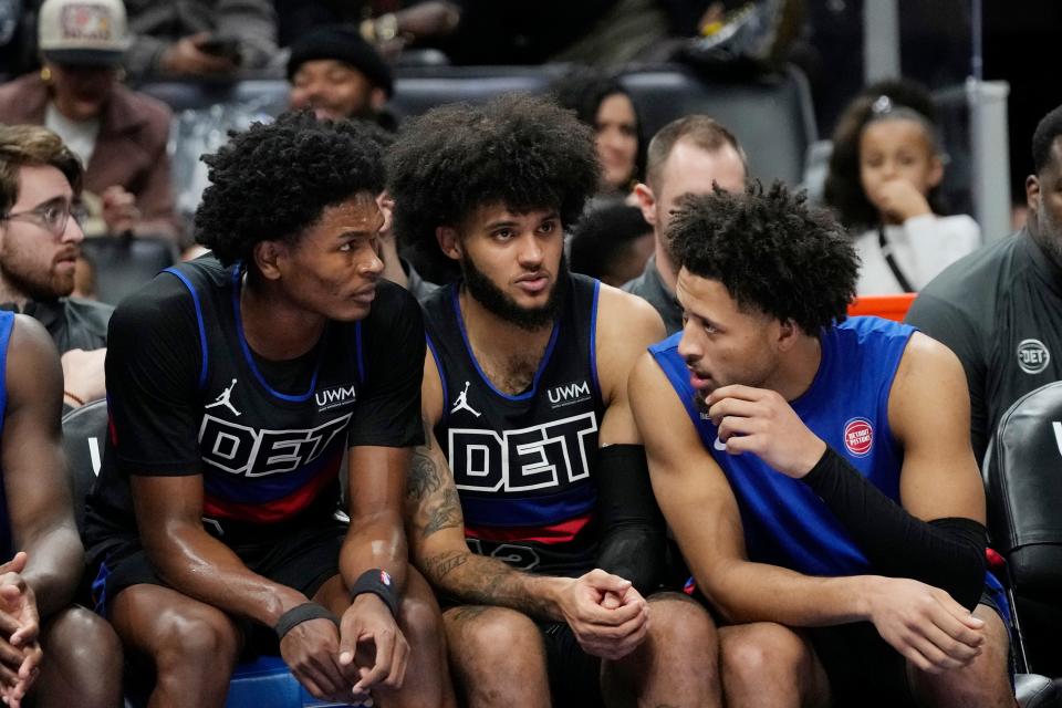 Left to right: Pistons' Ausar Thompson, Isaiah Livers and Cade Cunningham talk during the second half of the Pistons' 133-107 loss to the Lakers, Wednesday, Nov. 29, 2023, at Little Caesars Arena. The Pistons set a single-season franchise record with a 15 straight loss.