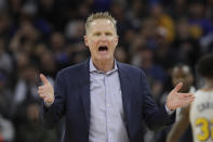 Golden State Warriors head coach Steve Kerr gestures toward an official during the first half of his team's NBA basketball game against the Toronto Raptors in San Francisco, Thursday, March 5, 2020. (AP Photo/Jeff Chiu)