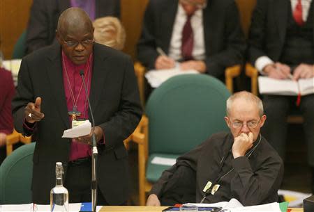 The Archbishop of York, John Sentamu (L), speaks next to the Archbishop of Canterbury Justin Welby at the General Synod in Church House in central London November 20, 2013. REUTERS/Andrew Winning