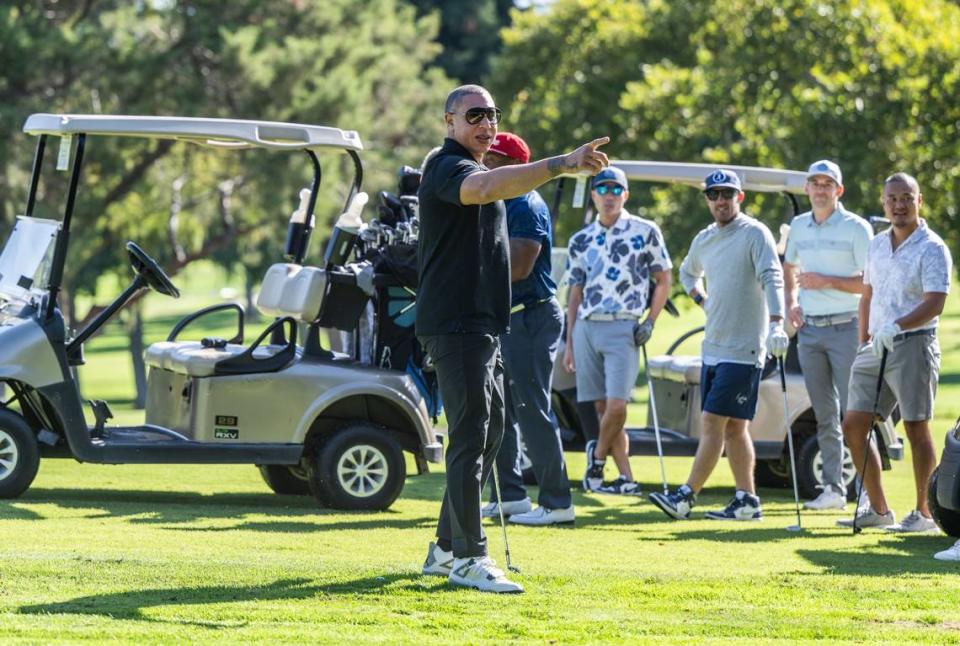 Former Sacramento Kings player Mike Bibby points to photographers as he participates in the third annual Phil Oates Celebrity Golf Classic on Monday at North Ridge County Club in Fair Oaks.