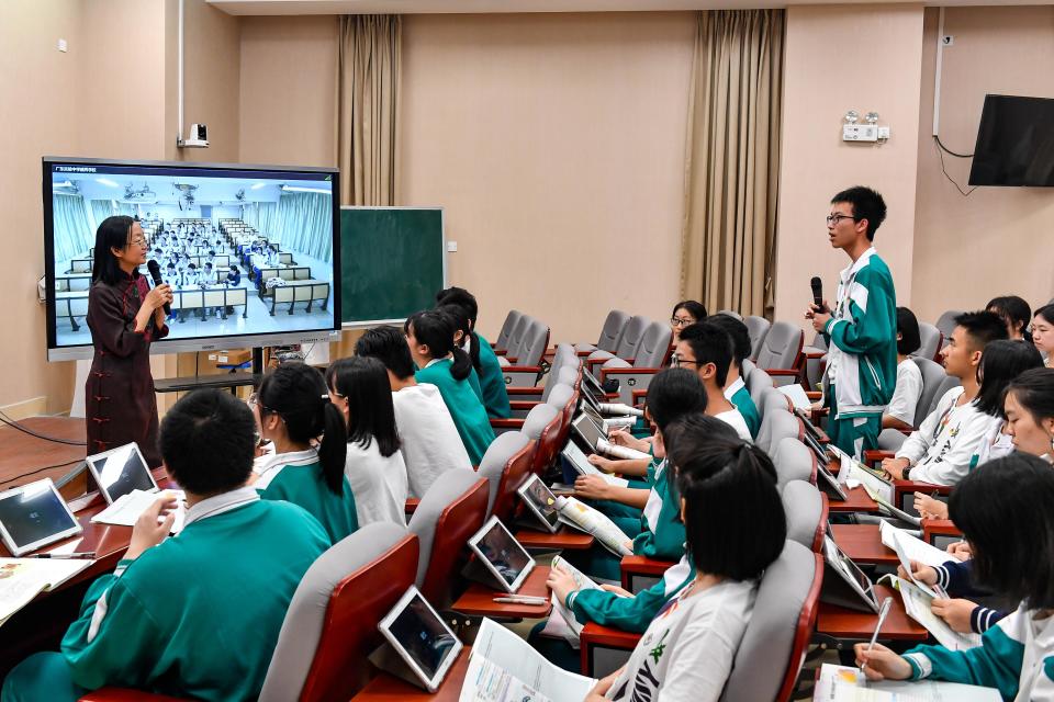 GUANGZHOU, CHINA - MARCH 29: Students from the main campus and branch campus of Guangdong Experimental High School take the same class through live broadcast via the 5G network supported by China Telecom on March 29, 2019 in Guangzhou, Guangdong Province of China. (Photo by Chen Jimin/China News Service/Visual China Group via Getty Images)
