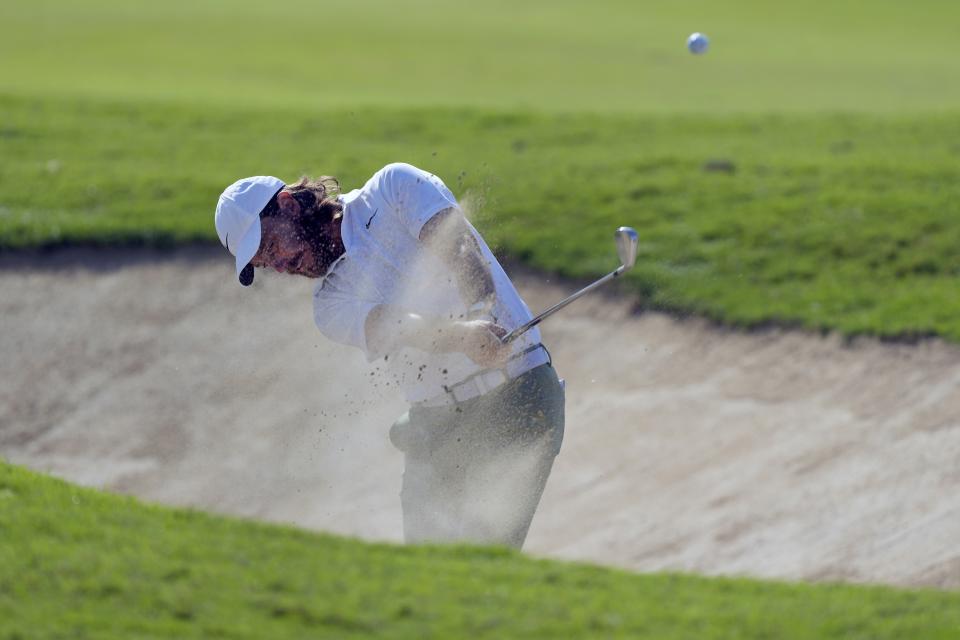 Tommy Fleetwood of England plays his second bunker shot on the 2nd hole during the third round of Dubai Invitational golf tournament, in Dubai, United Arab Emirates, Saturday, Jan. 13, 2024. (AP Photo/Kamran Jebreili)