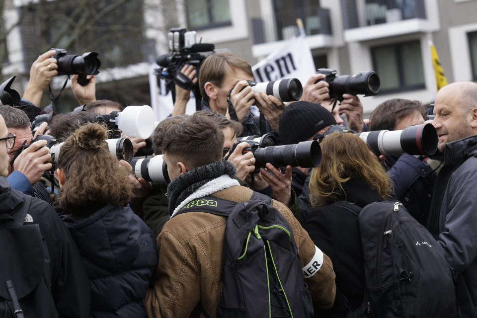 Private security guards controls media at the beginning of the Students 'Friday For Future' rally with Swedish climate activist Greta Thunberg, in Berlin, Germany, Friday, March 29, 2019. 2019. (AP Photo/Markus Schreiber)