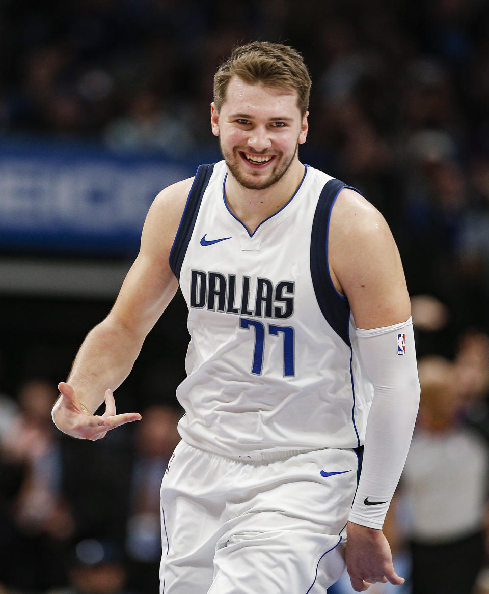 Dallas Mavericks forward Luka Doncic celebrates a 3-point shot during the second half of the team's NBA basketball game against the Brooklyn Nets on Thursday, Jan. 2, 2020, in Dallas. Dallas won 123-111. (AP Photo/Brandon Wade)