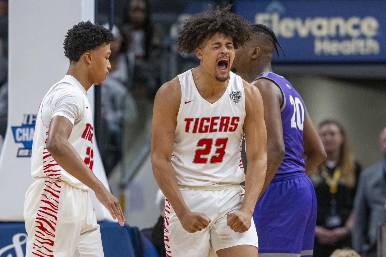 Fishers High School senior Keenan Garner (23) reacts after being fouled during the first half of an IHSAA class 4A state championship basketball game against Ben Davis High School, Saturday, March 30, 2024, at Gainbridge Fieldhouse.