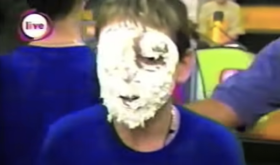 kid with pie cream on his face