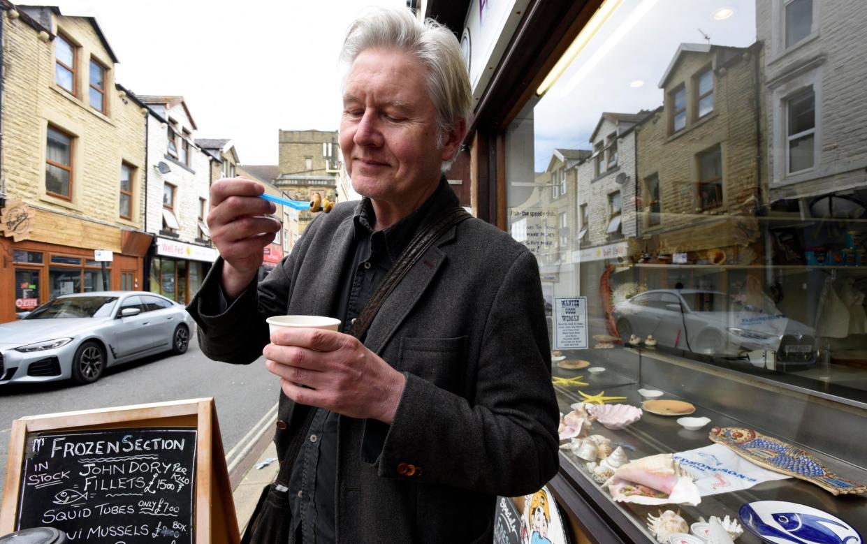 Writer Chris Moss sampling some of Morecambe's finest cockles and mussels