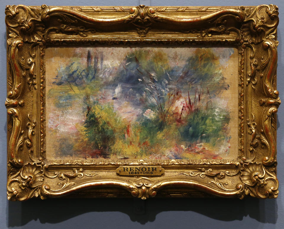 Pierre-Auguste Renoir's painting "On the Shore of the Seine" hangs at the Baltimore Museum of Art in Baltimore, Thursday, March 27, 2014, more than 60 years after it was stolen from the museum. The painting became the subject of a dramatic legal dispute after a Virginia woman claimed she bought it at a flea market for $7. A judge ultimately awarded ownership back to the Baltimore museum, and it is scheduled to go on public display March 30. (AP Photo/Patrick Semansky)