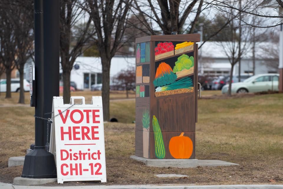 A sign on Shelburne Road at the entrance of Baldwin Avenue shows the way to the Orchard School polling station in South Burlington on Town Meeting Day, Tuesday, March 5, 2024.