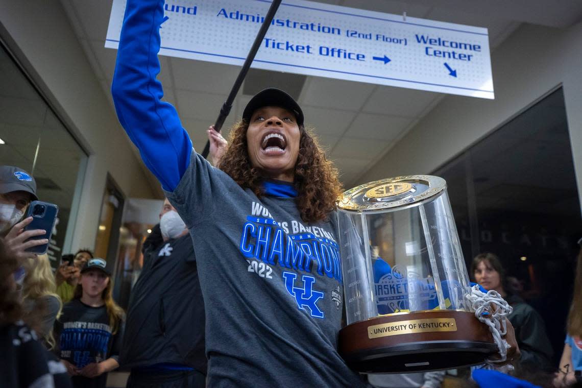 University of Kentucky womens basketball head coach Kyra Elzy carries the SEC Tournament trophy as the team arrives at the Joe Craft Center on the UK campus in Lexington, Ky., on Sunday, March 6, 2022, after winning the Southeastern Conference Tournament for the first time in 40 years.