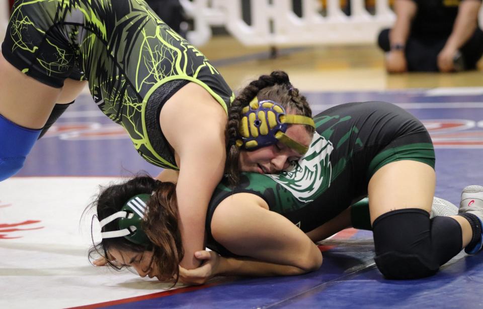 Ventura's Ava Ramos is in control of her match with Miranda Muro of Pacifica during the Channel League wrestling championships on Saturday at San Marcos High. Ramos won the 137-pound title.