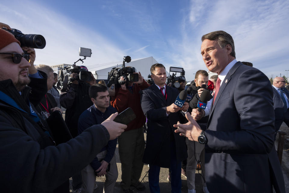 Virginia Gov. Glenn Youngkin speaks with reporters after an event where he and Ted Leonsis, owner of the Washington Wizards NBA basketball team and Washington Capitals HNL hockey team, announce plans for a new sports stadium for the teams, Wednesday, Dec. 13, 2023, in Alexandria, Va. Virginia Gov. Glenn Youngkin has reached a tentative agreement with the parent company of the NBA's Washington Wizards and NHL's Washington Capitals to move those teams from the District of Columbia to what he called a new "visionary sports and entertainment venue" in northern Virginia. (AP Photo/Alex Brandon)