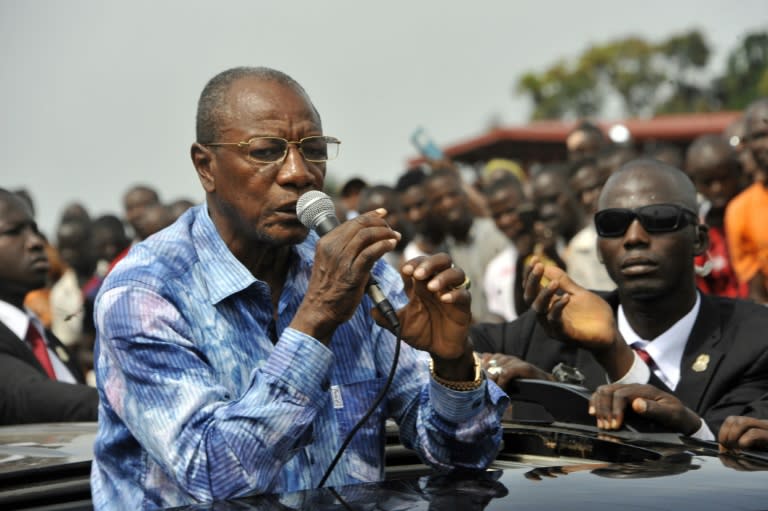 Guinea's President and candidate Alpha Conde speaks at a rally reiterating his call for calm in Conakry on October 9, 2015