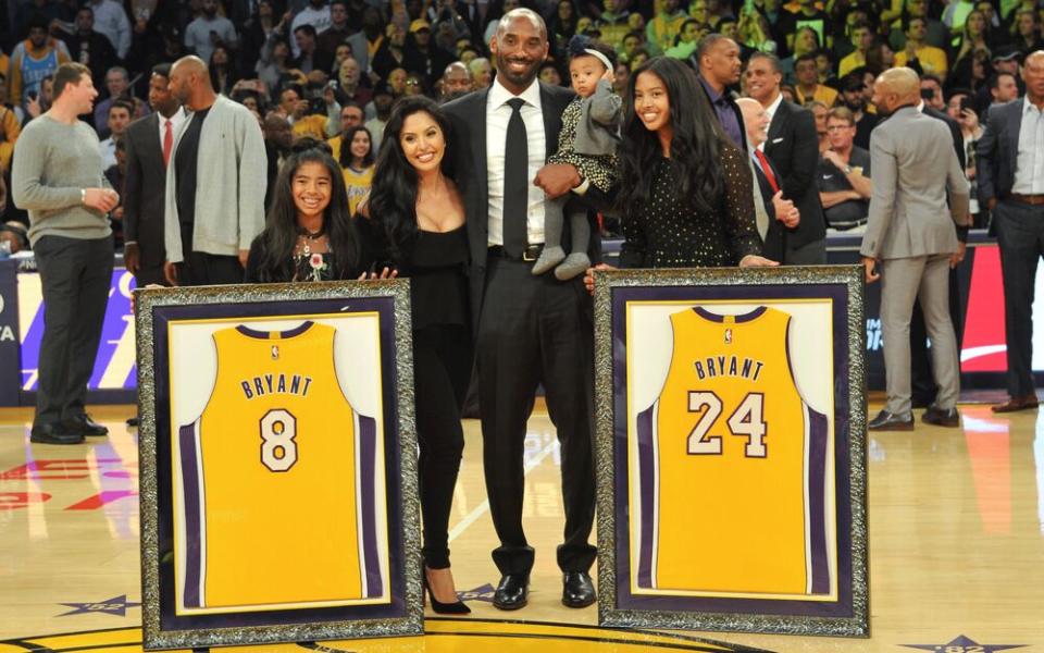 Kobe Bryant, wife Vanessa Bryant and daughters Gianna Maria Onore Bryant, Natalia Diamante Bryant and Bianka Bella Bryant attend Kobe Bryant's jersey retirement ceremony during halftime of a basketball game between the Los Angeles Lakers and the Golden State Warriors at Staples Center on December 18, 2017. | Getty Images