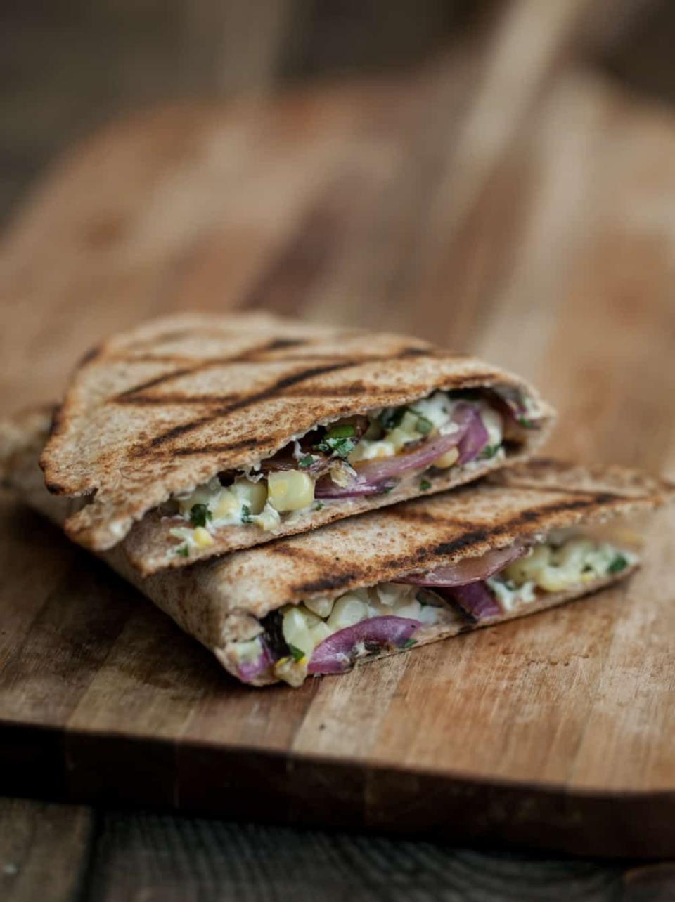 <p>The whipped coriander goat's cheese in this recipe sounds amazing.</p><p>Get the <a href="https://naturallyella.com/grilled-corn-onion-and-whipped-cilantro-goat-cheese-quesadilla/" rel="nofollow noopener" target="_blank" data-ylk="slk:Grilled Corn, Onion, and Whipped Coriander Goat's Cheese Quesadilla" class="link ">Grilled Corn, Onion, and Whipped Coriander Goat's Cheese Quesadilla</a> recipe. </p><p>Recipe from <a href="https://naturallyella.com/" rel="nofollow noopener" target="_blank" data-ylk="slk:Naturally Ella" class="link ">Naturally Ella</a>. </p>