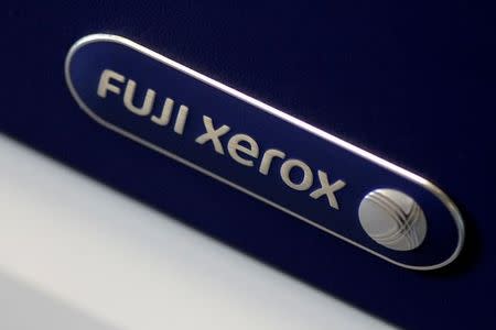 The Fuji Xerox logo is seen on a photocopier in this illustration photo January 19, 2018. REUTERS/Thomas White/Illustration/Files